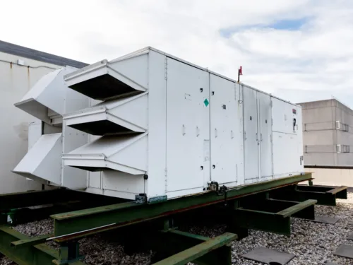 A large, white industrial HVAC unit on a rooftop.